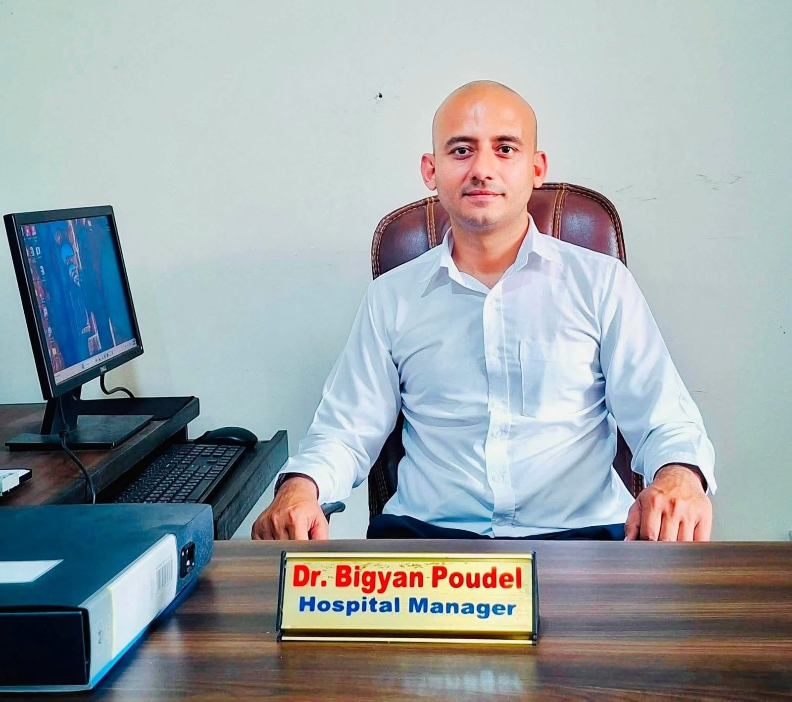 Dr. Bigyan Poudel at his desk as Hospital Manager of Bharatpur Hospital